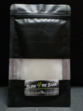 Product packaging with a label on a dark background